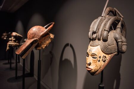 Tenerife, Spain - February 8 2019 : African tribal wooden hand carved mask at African tribal culture exhibition.のeditorial素材