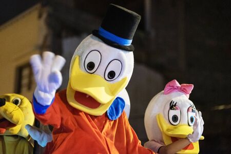 Tenerife, Spain - January 5, 2019: Disguised cartoon characters during Three kings parade celebration. Cabalgata de Reyes magos is a traditional epiphany Spanish celebration.のeditorial素材