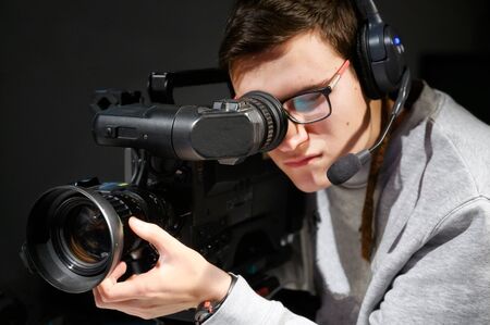 Cameraman using professional digital video camera .