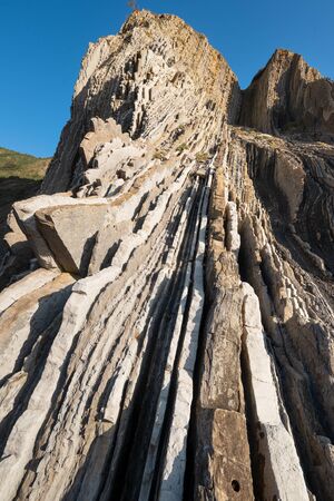 Rock strata, geological texture background detail in Zumaia, Basque Country, Spain.