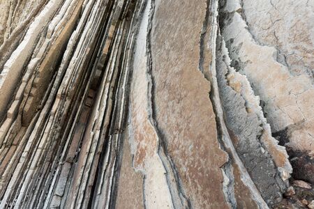Rock strata, geological texture background detail in Zumaia, Basque Country, Spain.