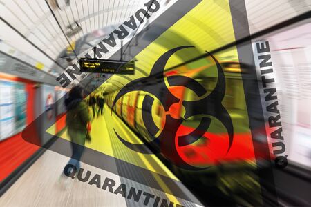 United Kingdom Quarantine Covid-19. Travellers waiting at London underground station. Travel ban quarantine for public transport over Corona virus Coronavirus panic social distancing.の写真素材
