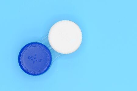 Contact lens case on blue pastel background.の写真素材