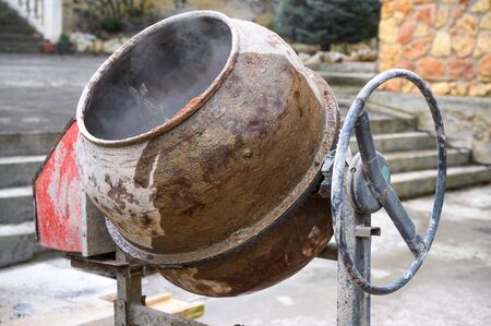 Industrial Cement Mixer Machinery on construction site.の写真素材