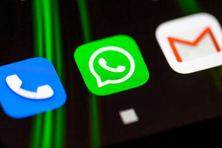 Burgos, Spain - April 13, 2020: WhatsApp, phone and gmail application icon on smartphone screen.のeditorial素材