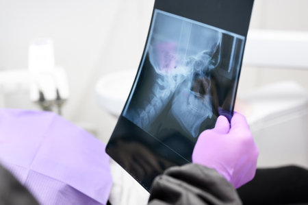 Dentist Explaining The Details Of A X-Ray Picture To Her Patient