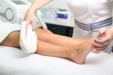 Laser epilation and cosmetology in beauty salon. Cosmetology, spa and hair removal concept