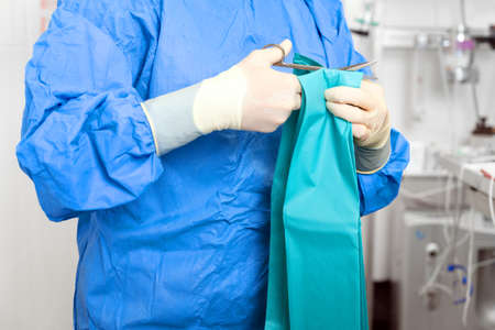 Female nurse preparing operation theatre for surgery.の写真素材
