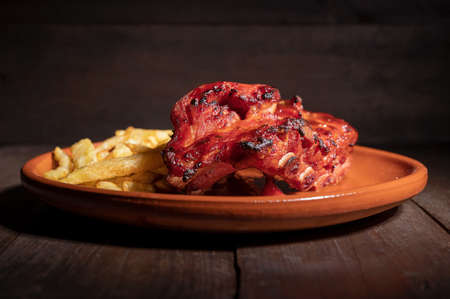 Tracking shot of delicious Grilled bbq ribs on stone plate.の写真素材