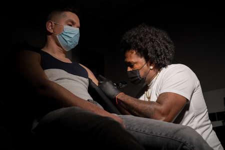 Body art at the tattoo studioの写真素材