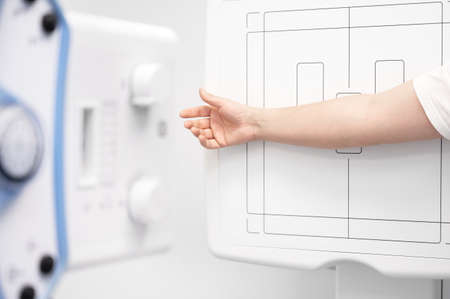 Man in x-ray room having medical scan examination in a modern hospital.の写真素材