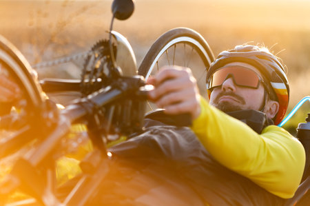 Close up of an athlete with disability preparing hand bike for training.の写真素材