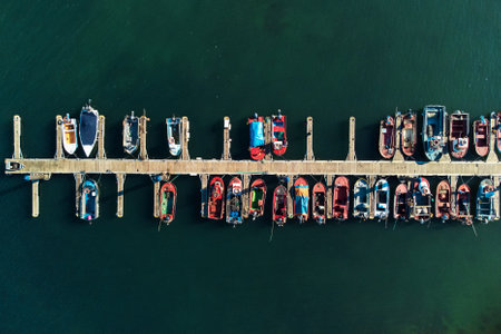 Aerial drone footage of fishing boats moored at the marina.の写真素材