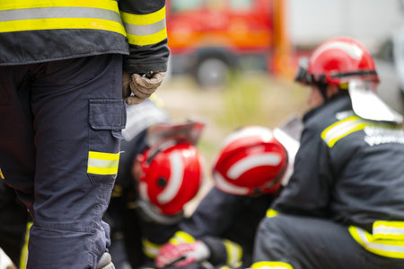 Car Crash Traffic Accident. Firefighters Rescue Injured Trapped Victims. Firemen give First Aid to passengers.の写真素材