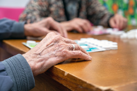 Close up of a senior group playing bingo at Nursing home. leisure game, support, assisted living, and retirement.の写真素材