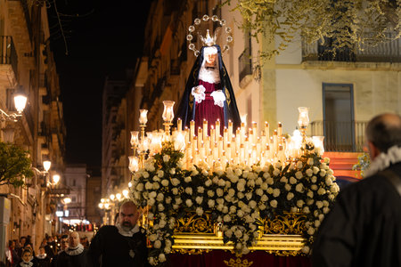 Tarragona, Catalonia, Spain - April 6, 2023: Celebration of Holy Week, the procession circulates...