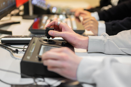 Video editor working with footage using modern video editing software and hardware control panel, creating professional content for multimedia projectsの写真素材