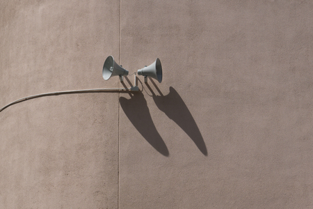 Speaker with shadow on a wallの写真素材