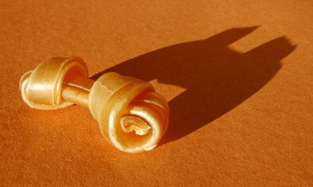Rawhide Dog Chew with dramatic side lightingの写真素材