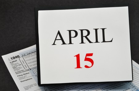 April 15 on calendar and 1040 tax formの写真素材