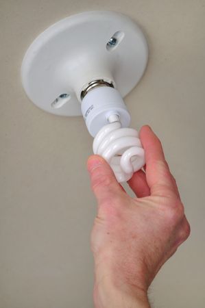 Installing energy efficient compact fluorescent light (CFL)
