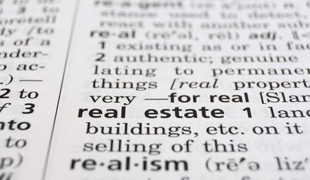 The word Real Estate in a dictionary, closeupの写真素材