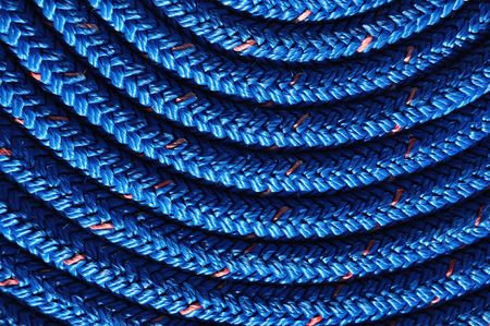 Close-up of Coiled Blue Rope for a backgroundの写真素材