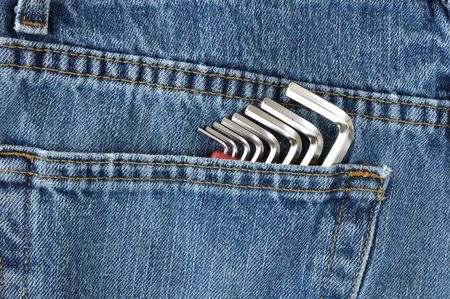 Close-up of Hex Key Wrenches in Blue Jeans Pocketの写真素材