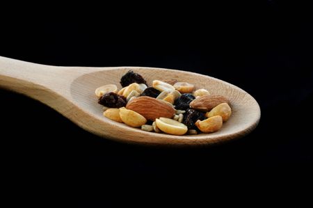 Trail Mix (Peanuts, Almonds, Sunflower Seeds, &  Raisins) on Wooden Spoonの写真素材