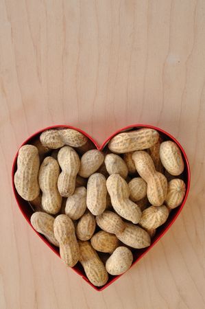 Peanuts in the Shell in Heart Shaped Cookie Cutterの写真素材