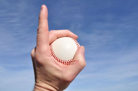 Player Gripping a New Baseball Doing Number One Signの写真素材