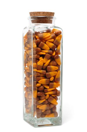 Candy Corn in a Glass Jar Isolated on White