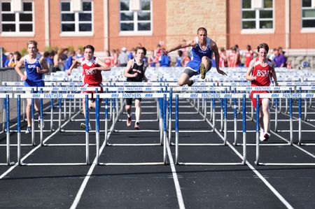 SPRING LAKE PARK, MN - APRIL 20: High school boys hurdles race April 20, 2010 in Spring Lake Park, Minnesota.のeditorial素材