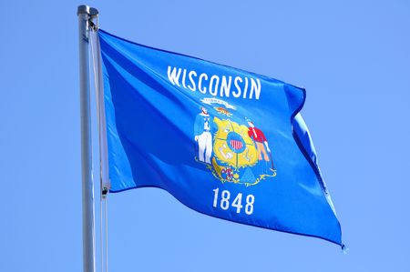 Wisconsin State Flag Against a Blue SKyの写真素材