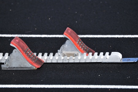 Empty Starting Blocks on a Black Track