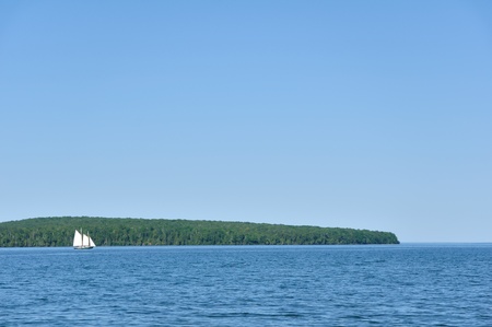 Schooner Sailboat Sailing on a Beautiful Summer Dayの写真素材