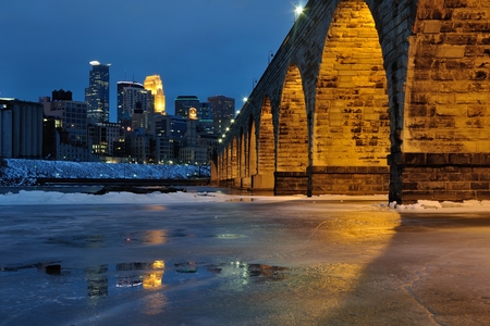 Stone Arch Bridge and Minneapolis Skyline at Nightの写真素材