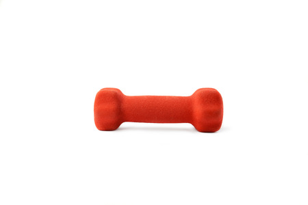 Small red dumbbell on white background,soft focus,health concept.の写真素材