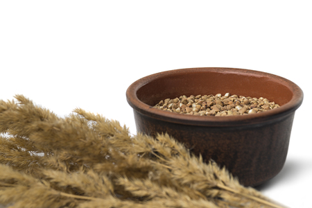 buckwheat in a bowl white backroundの写真素材