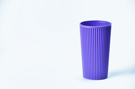 Blue empty plastic cup isolated on white backgroundの写真素材