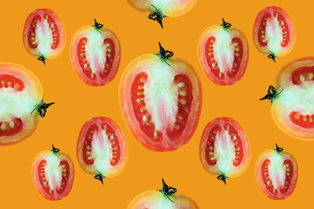 Fly of beautiful trendy seamless pattern cherry tomato isolated on orange background