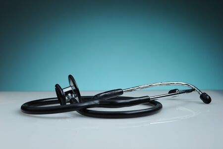 Close-up of a Stethoscope on dark blue background の写真素材