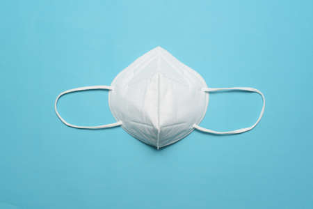 Medical mask, Medical protective mask isolated on blue background. hygiene conceptの写真素材