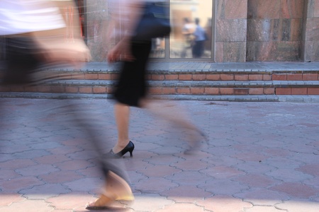 Walking on the sidewalk people の写真素材