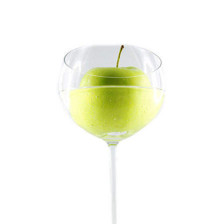 Green apple in a glassの写真素材