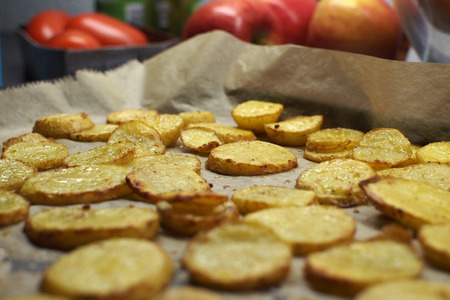 Fried potatoes on a baking trayの写真素材