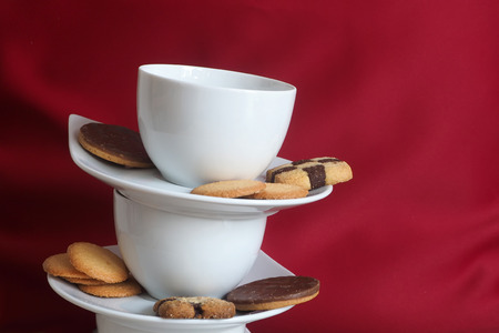 Cookies and stacked coffee cupsの写真素材