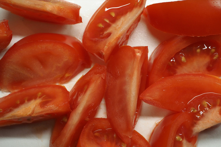 Tomatoes cut in wedgesの写真素材