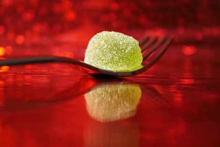 A fork with a green wine gumの写真素材