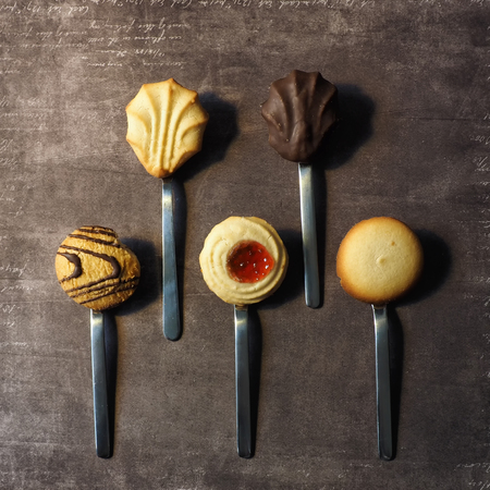 Assorted cookies on spoonsの写真素材